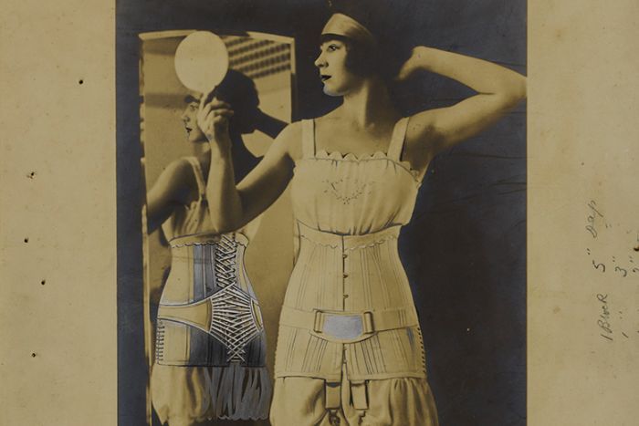Young woman modelling a Jenyns corset ca. 1920